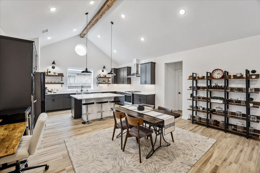 Open dining space perfectly positioned between the kitchen and living room, ideal for everyday living and entertaining.