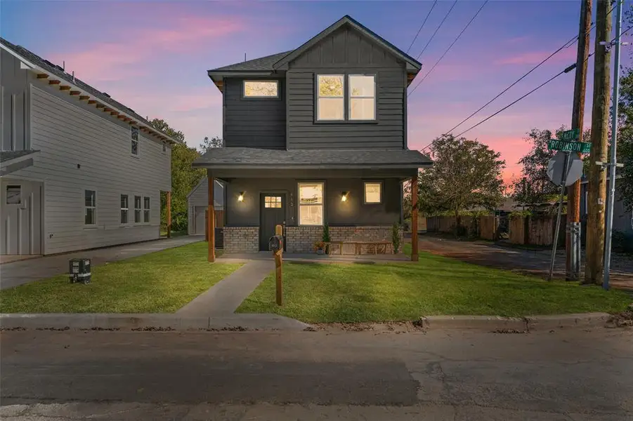 Front exterior of a new home in , Cleburne, TX, highlighting curb appeal (Image 1).
