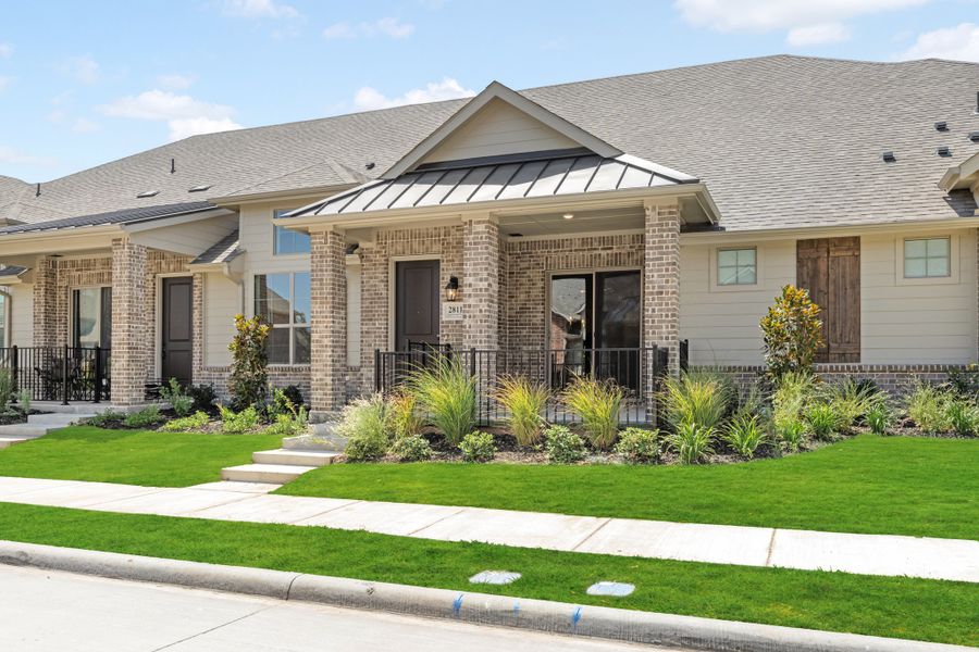 Front exterior of a new home in Woodbridge Villas, Wylie, TX, highlighting curb appeal (Image 27).