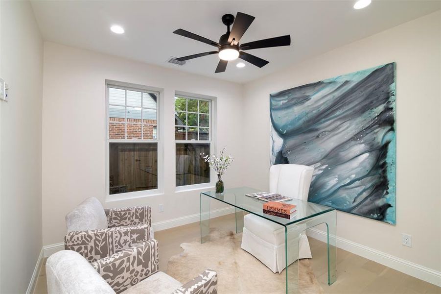 Office space featuring ceiling fan and hardwood / wood-style flooring