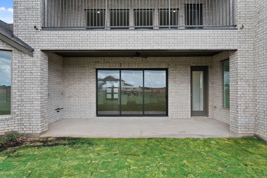 Exterior details and patio area of a home in Dunham Pointe 70', Cypress (Image 3).