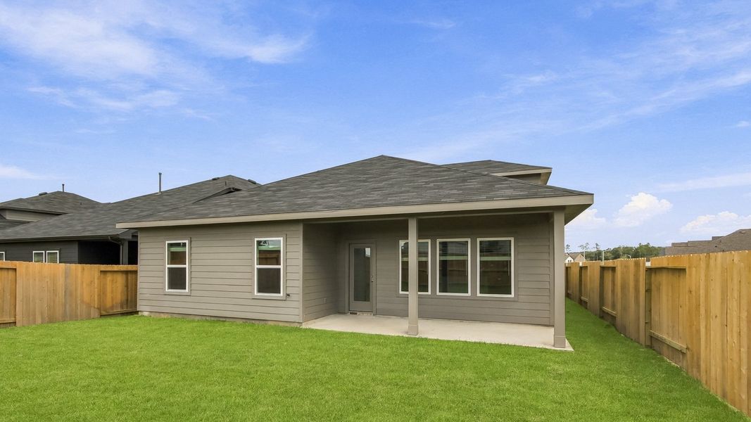 Exterior details and patio area of a home in Harrington Trails at The Canopies, Splendora (Image 4).
