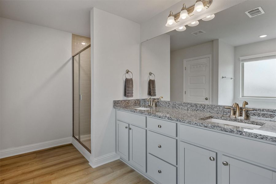 Primary Bathroom with Double Sinks, Bath Tub and Separate Shower