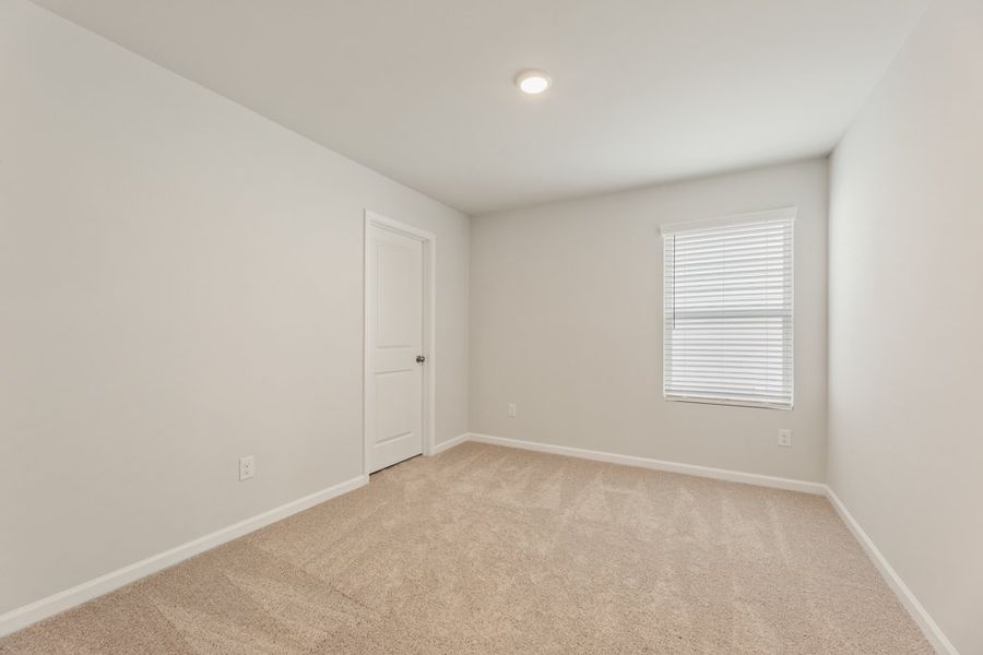 A room with a door and a window.