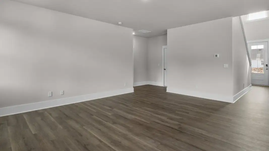 Representative unfurnished interior of a home built from the Forrester by D.R. Horton in The Highlands at Cedar Hill Landing, Navassa (Image 21).