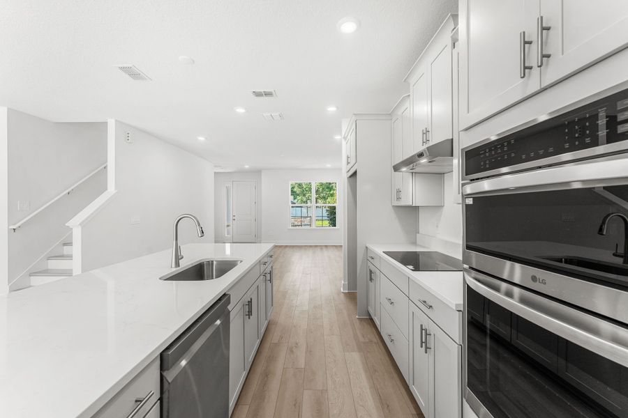 Sleek Countertops and Stainless Steel Appliances Sleek Countertops and Stainless Steel Appliances