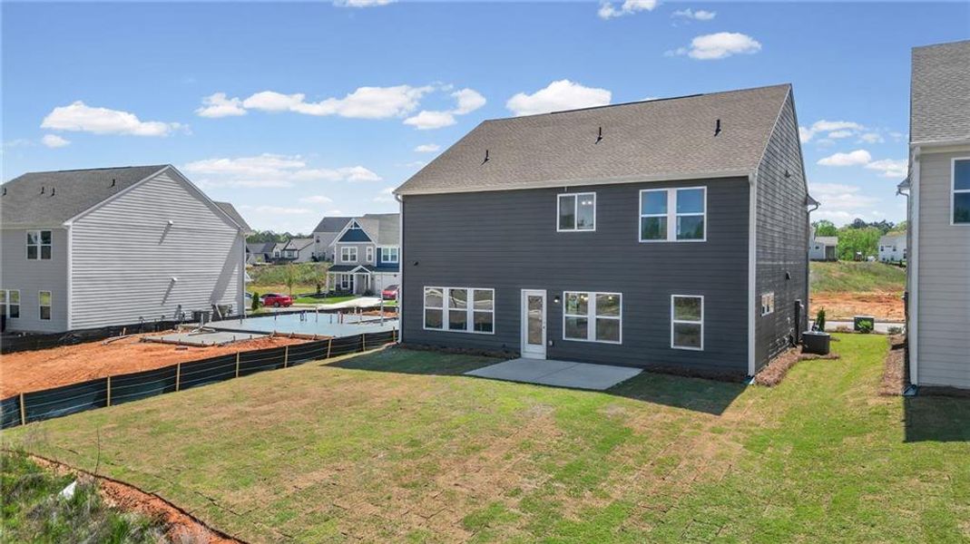 Exterior details and patio area of a home in Twin Lakes, Hoschton (Image 29).