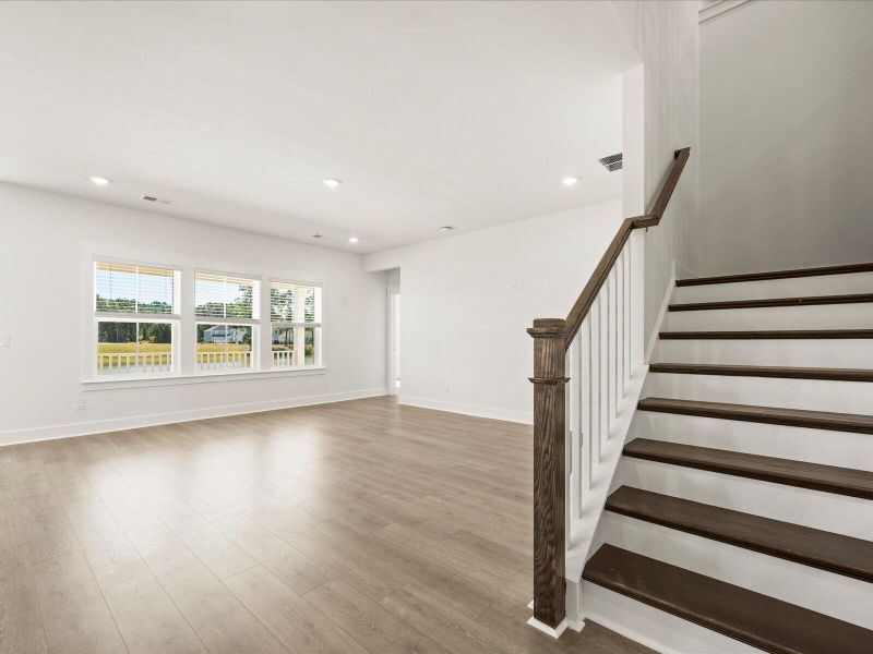 Spacious, unfurnished interior of a new home in The Coves at Lakes of Cane Bay II, Summerville (Image 18).