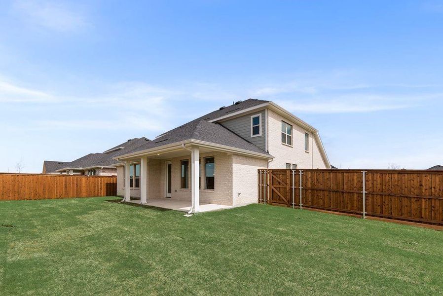 Exterior details and patio area of a home in Spiritas Ranch, Little Elm (Image 3).