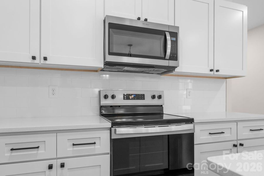 Subway backsplash and stainless appliances
