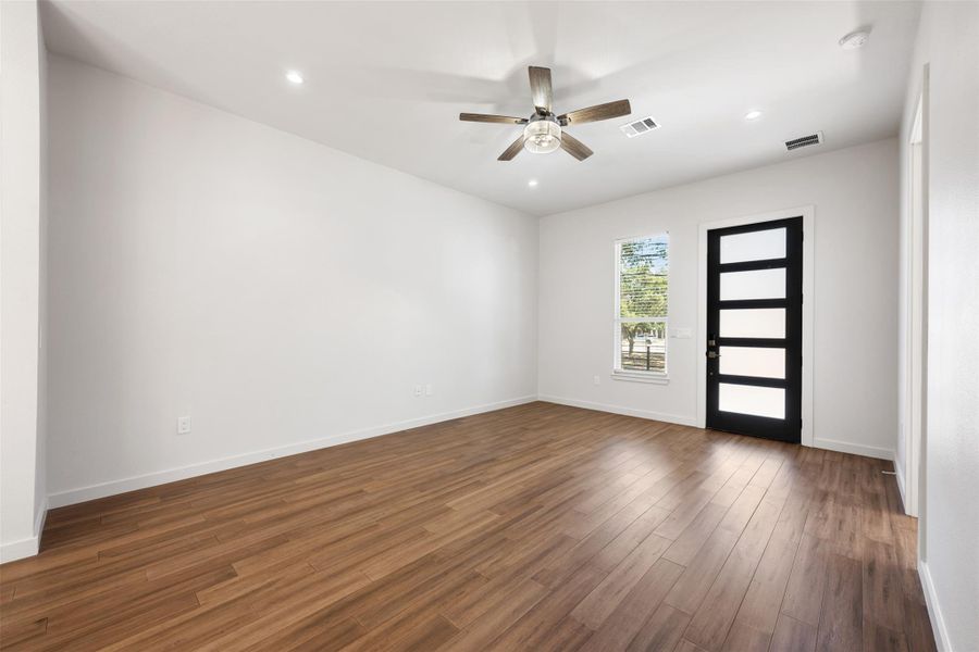 Foyer entrance with dark wood finished floors, recessed lighting, and ceiling fan