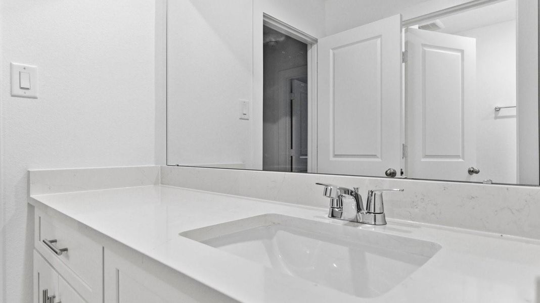 A well-designed bathroom equipped with granite countertops, a standing tub, and a single vanity. A well-designed bathroom equipped with granite countertops, a standing tub, and a single vanity.