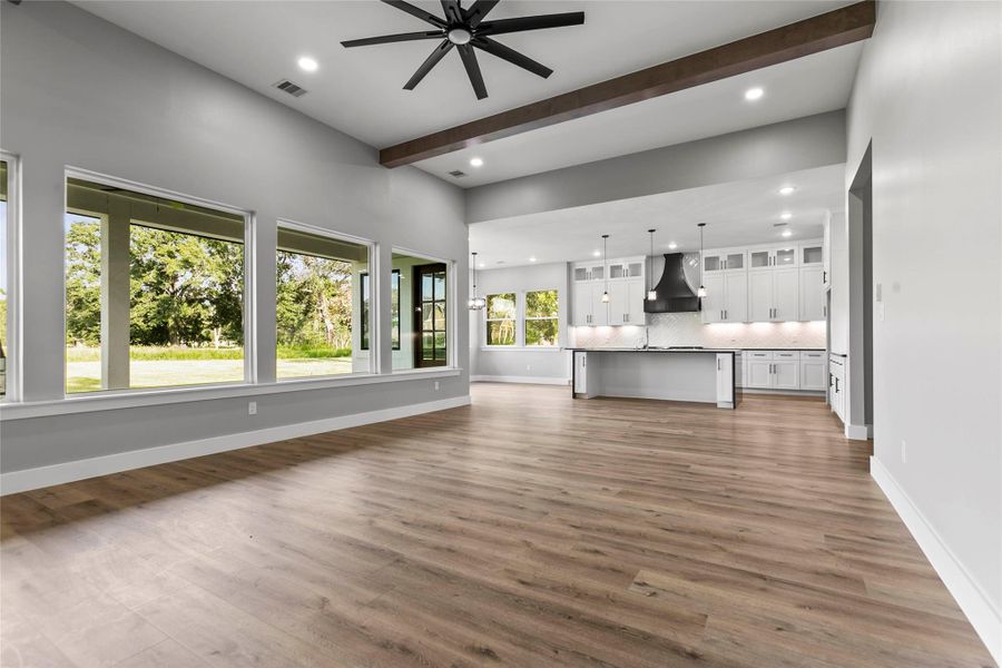 The open living room and kitchen…perfect for entertaining and large gatherings. The open living room and kitchen…perfect for entertaining and large gatherings.