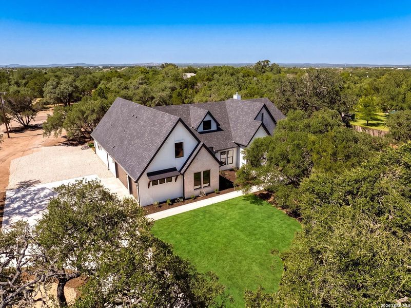 Front exterior of a new home in , Boerne, TX, highlighting curb appeal (Image 26).