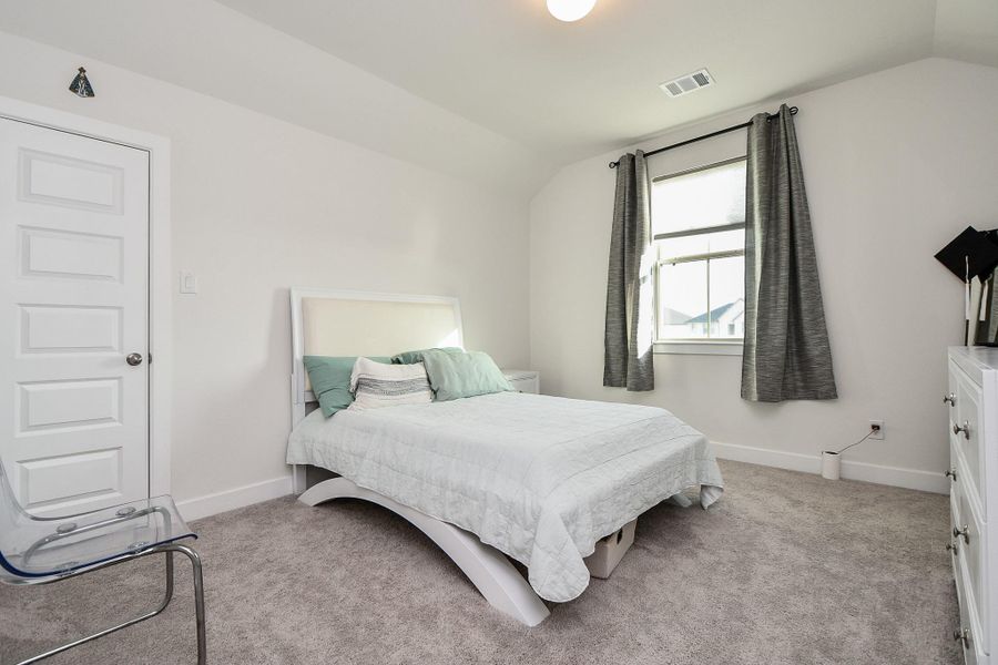 Another spacious secondary bedroom welcomes sizeable pieces and great natural light. Another spacious secondary bedroom welcomes sizeable pieces and great natural light.