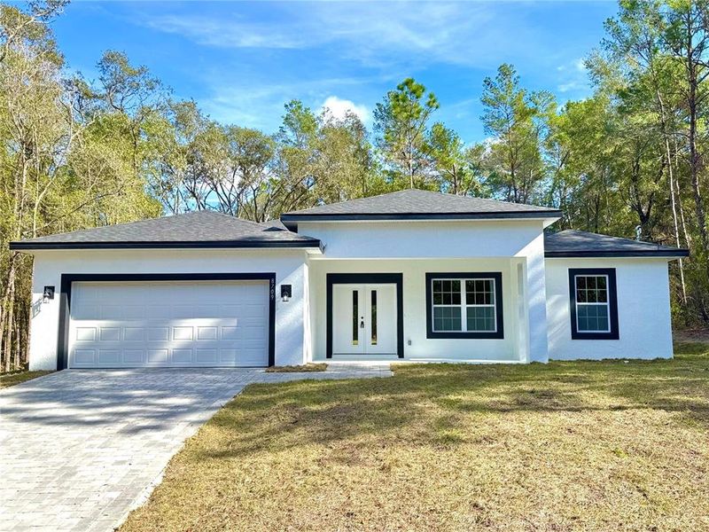 Front exterior of a new home in , Dunnellon, FL, highlighting curb appeal (Image 1). Front exterior of a new home in , Dunnellon, FL, highlighting curb appeal (Image 1).