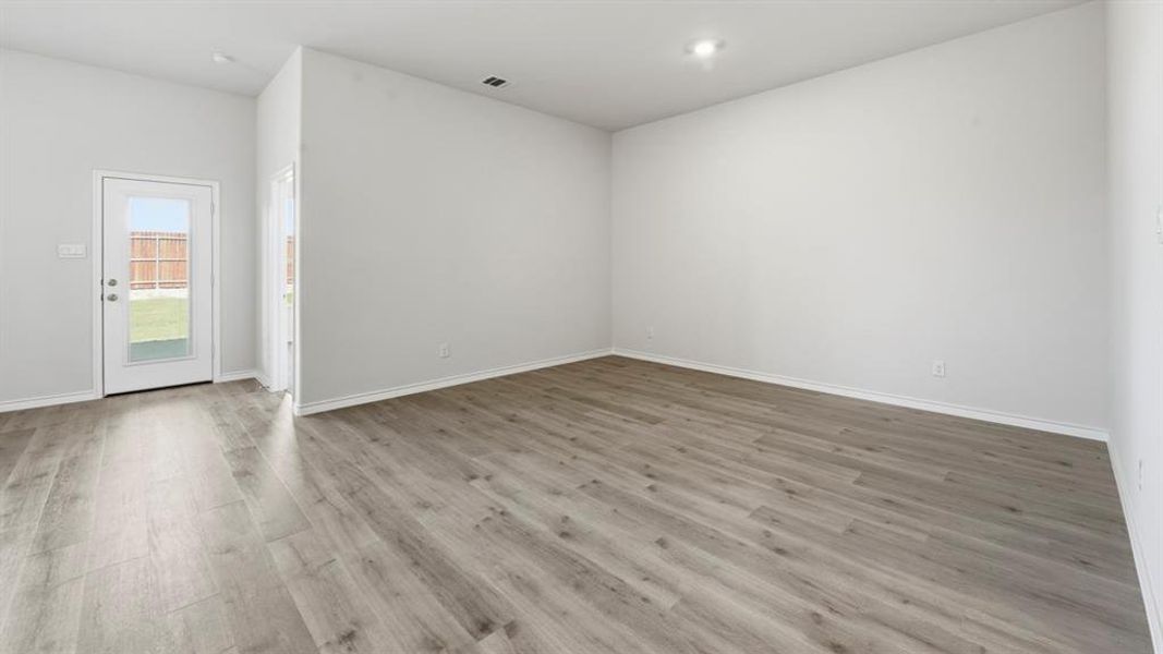 Spare room featuring light wood-style flooring and recessed lighting Spare room featuring light wood-style flooring and recessed lighting