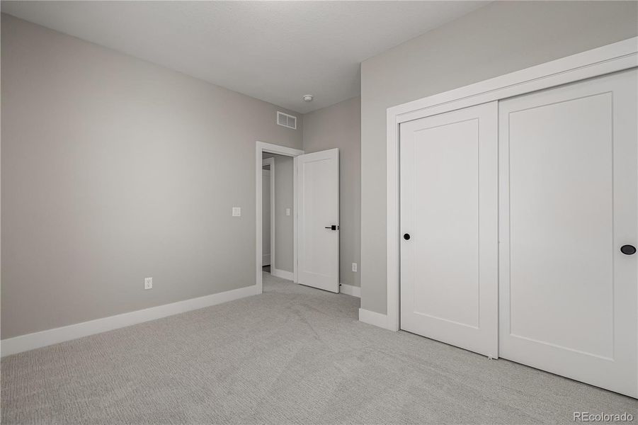 Spacious, unfurnished interior of a new home in West Grange, Longmont (Image 40).