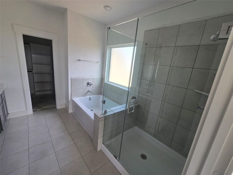 Primary Bath - Whether you're prepping for a busy day or winding down at night, this beautiful new construction invites you to indulge in comfort and elegance every time you step inside. Primary Bath - Whether you're prepping for a busy day or winding down at night, this beautiful new construction invites you to indulge in comfort and elegance every time you step inside.