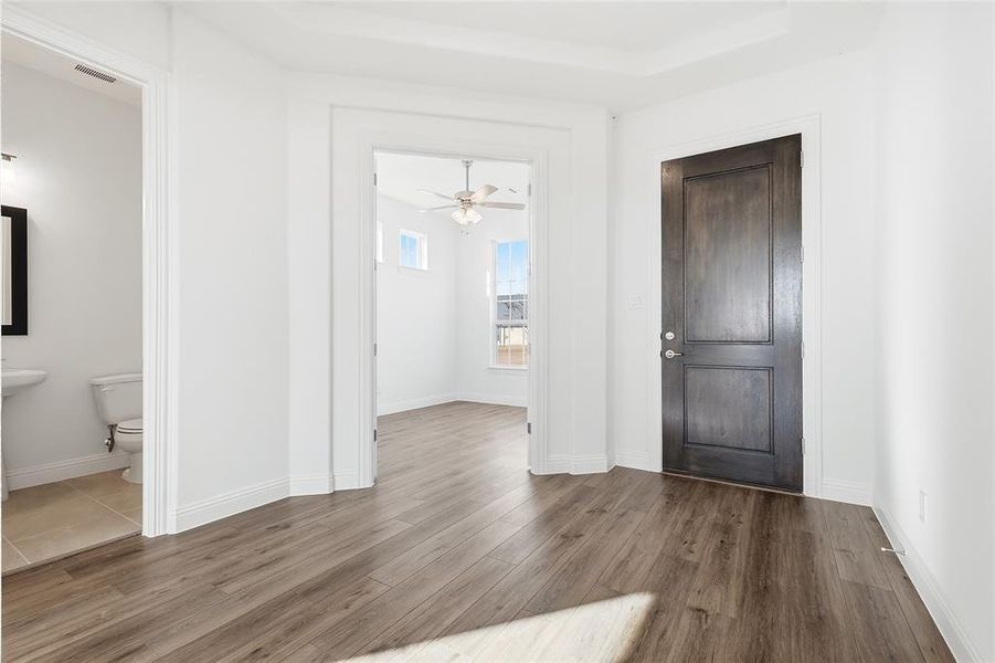 Foyer with dark wood-style flooring and ceiling fan Foyer with dark wood-style flooring and ceiling fan
