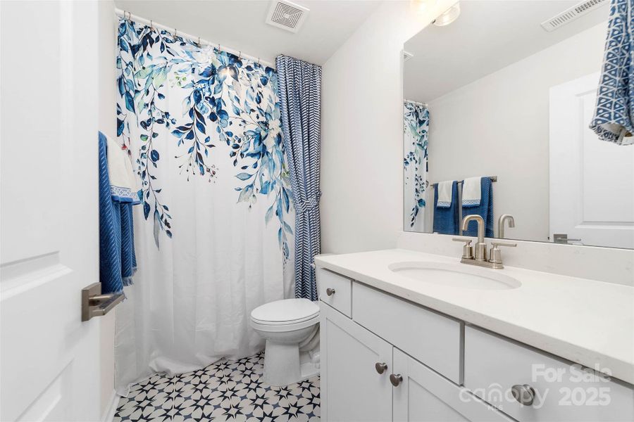 Upper level full bathroom with custom tile