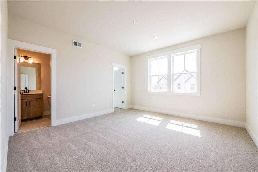 Spacious, unfurnished interior of a new home in The Paddocks at Doc Hughes, Buford (Image 41).