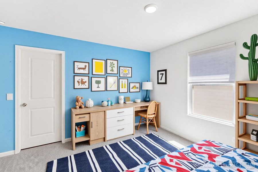 Bedroom with light carpet and a desk