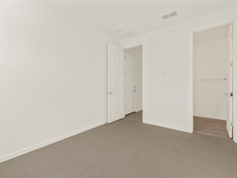 Spacious, unfurnished interior of a new home in Mesquite Mountain Ranch at Frontera, Surprise (Image 14).