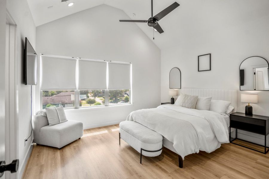 Third-floor primary suite with soaring vaulted ceiling—space and style in perfect harmony.