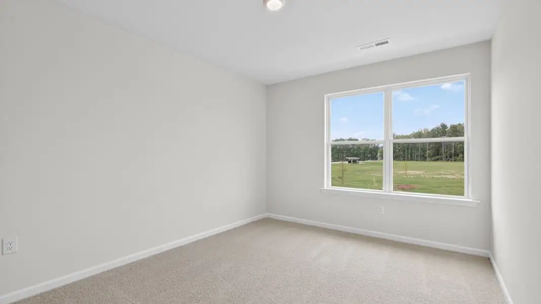 Spacious, unfurnished interior of a new home in The Townes at Anderson Farm, Wendell (Image 23).