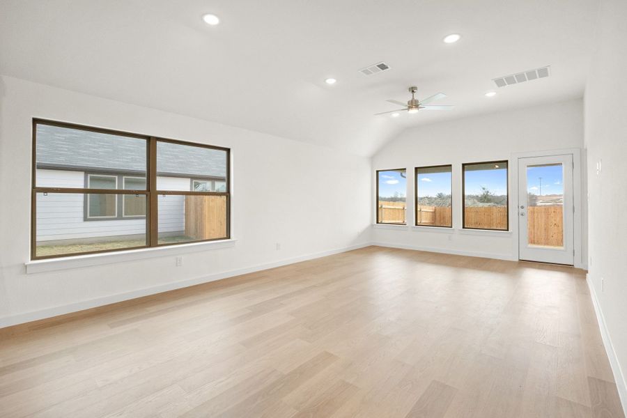 Dining and Living Area in the Turquoise home plan by Trophy Signature Homes – REPRESENTATIVE PHOTO