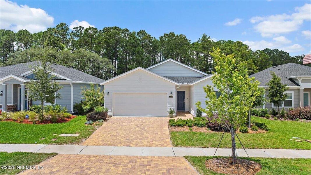 Front exterior of a new home in Edenbrooke at Hyland Trail | 55+, Green Cove Springs, FL, highlighting curb appeal (Image 2).
