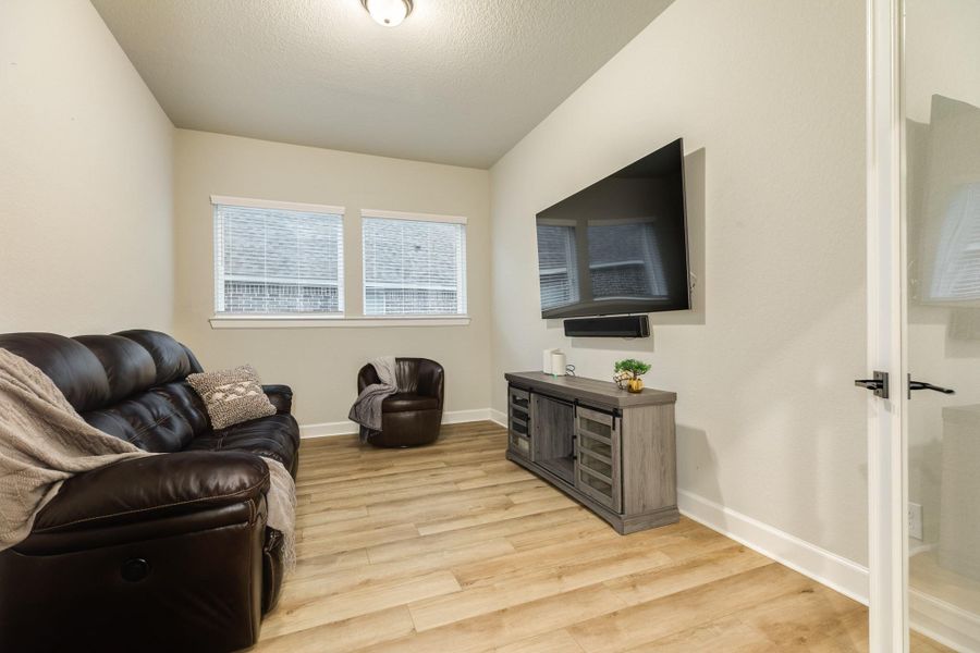 This office/flex space is perfect for work or play. The large windows provide plenty of natural light that complement the double glass doors. Whether you prefer to use it as an office, media room, fitness/yoga studio, man cave, or children's play area, this room does the trick. It can accommodate your specific needs and has enough room to be whatever you decide