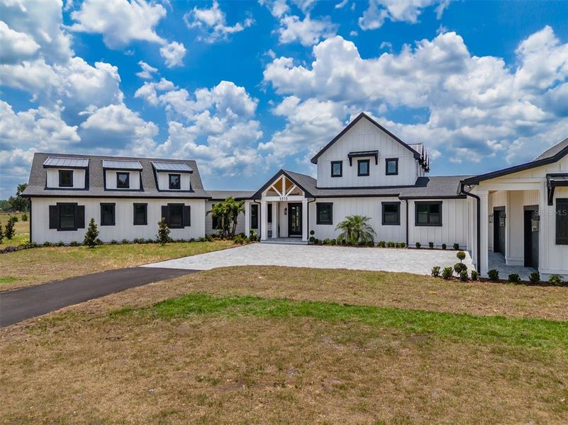 Front exterior of a new home in , Lithia, FL, highlighting curb appeal (Image 21).