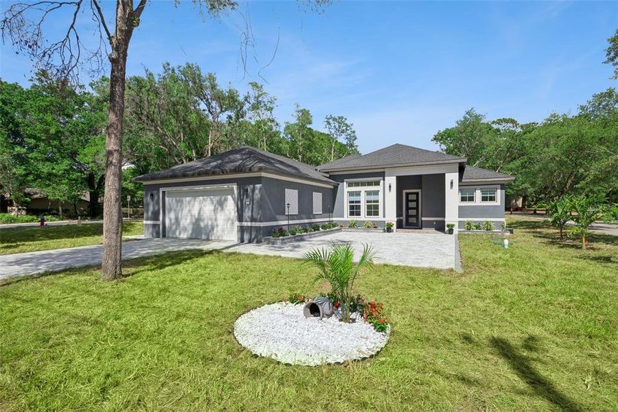 Front exterior of a new home in , Apopka, FL, highlighting curb appeal (Image 27).