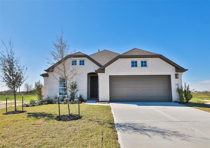 Front exterior of a new home in River Ranch, Dayton, TX, highlighting curb appeal (Image 1). Front exterior of a new home in River Ranch, Dayton, TX, highlighting curb appeal (Image 1).