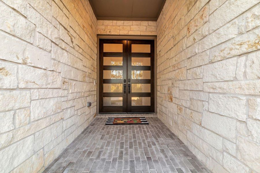 Exterior details and patio area of a home in The Highlands - 65', Porter (Image 3). Exterior details and patio area of a home in The Highlands - 65', Porter (Image 3).