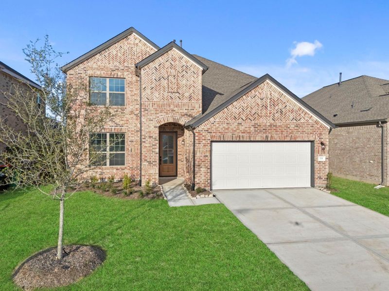 Front exterior of a new home in Brookewater, Rosenberg, TX, highlighting curb appeal (Image 23).