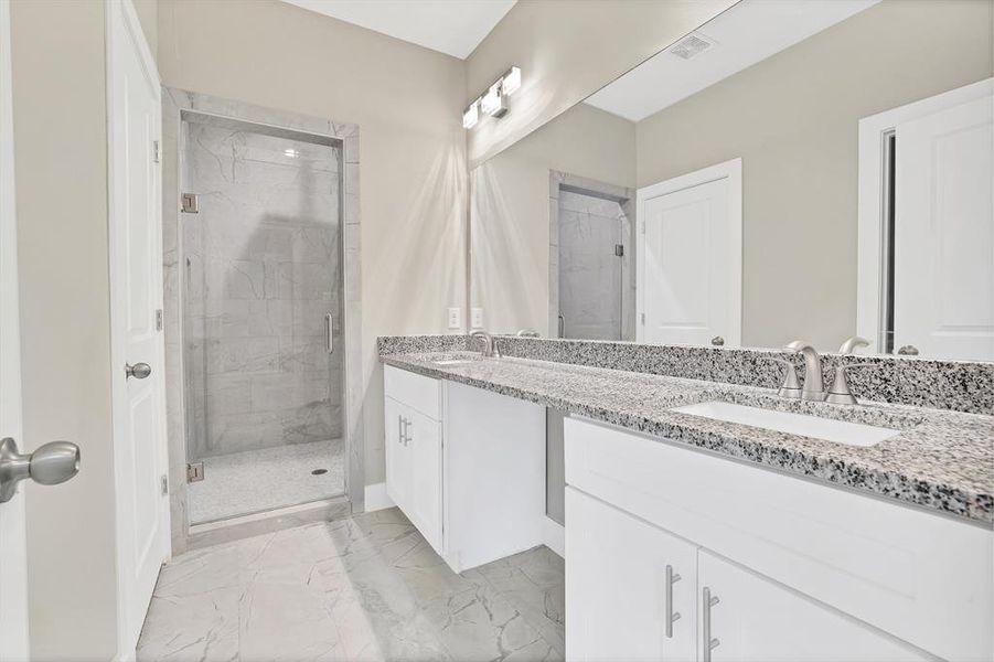 Bathroom with vanity and walk in shower