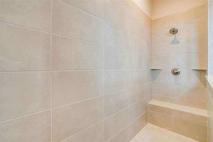 Bathroom featuring tiled shower