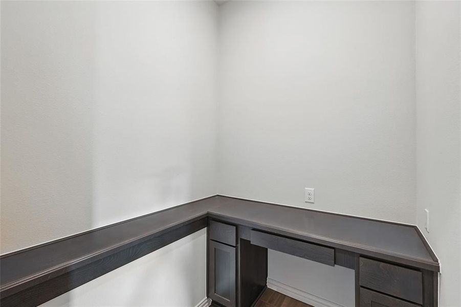 Unfurnished office with dark wood-type flooring Unfurnished office with dark wood-type flooring