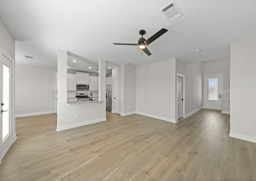 The spacious family room has plenty of room for furniture. The spacious family room has plenty of room for furniture.