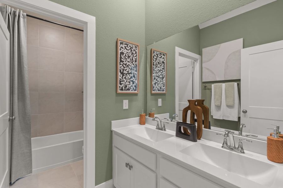 Representative furnished interior of a home built from the Versailles by Chesmar Homes in The Woodland Hills Chateau, Willis (Image 11).