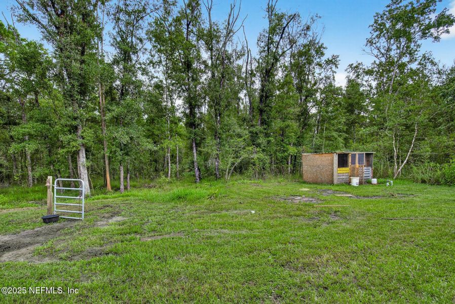 Front exterior of a new home in Flagler Estates, Hastings, FL, highlighting curb appeal (Image 22).