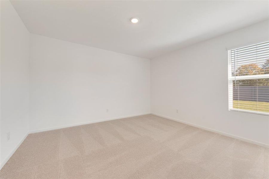 Unfurnished room with light colored carpet