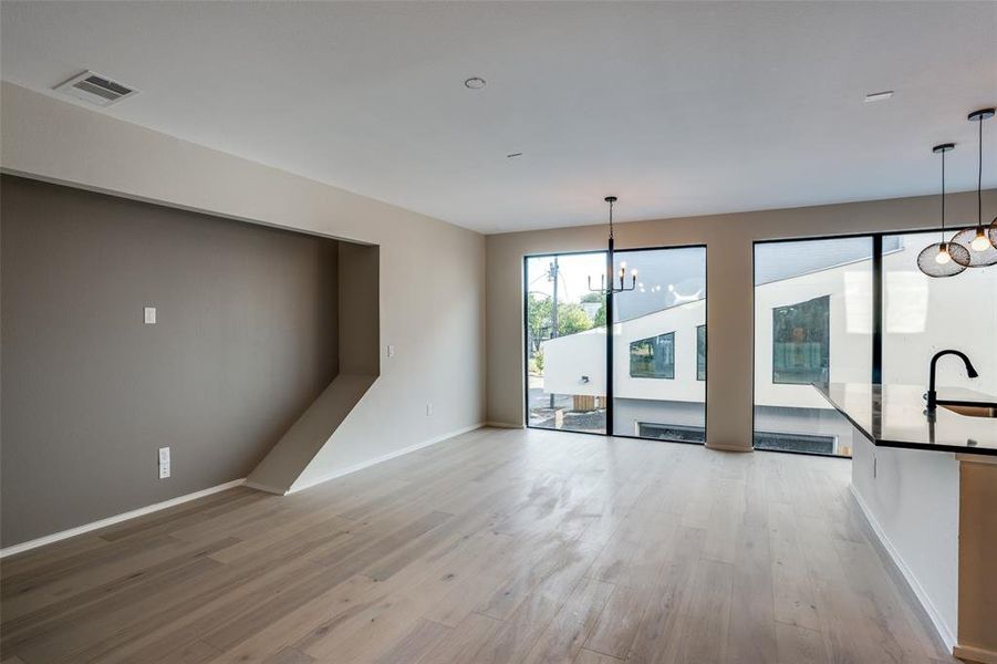 Photos are of unit #204. Unit #101 will feature white cabinets and grey wood floors. Photos are of unit #204. Unit #101 will feature white cabinets and grey wood floors.