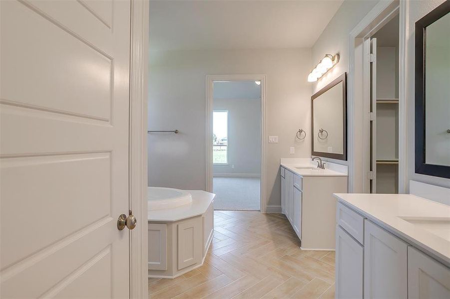 Bathroom with vanity and parquet flooring