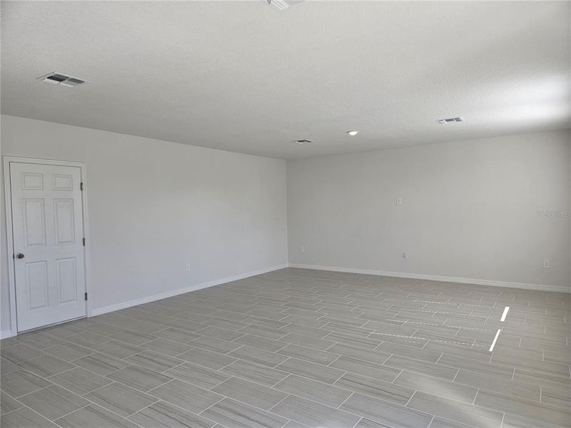 Spacious, unfurnished interior of a new home in Lawson Dunes - Signature Series, Haines City (Image 34).
