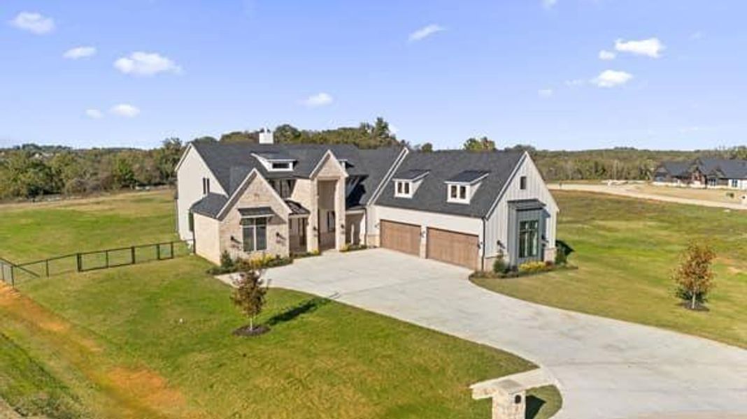 Front exterior of a new home in , Argyle, TX, highlighting curb appeal (Image 2). Front exterior of a new home in , Argyle, TX, highlighting curb appeal (Image 2).