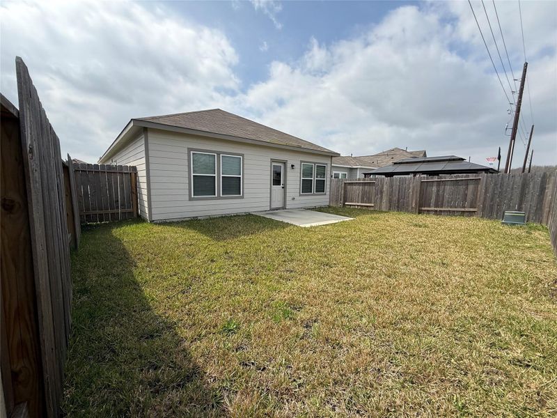 Exterior details and patio area of a home in Barrett Crossing, Crosby (Image 4).